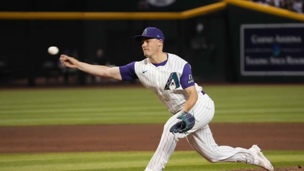 Paul Sewald throwing a pitch during the ninth inning on August 12th, 2023